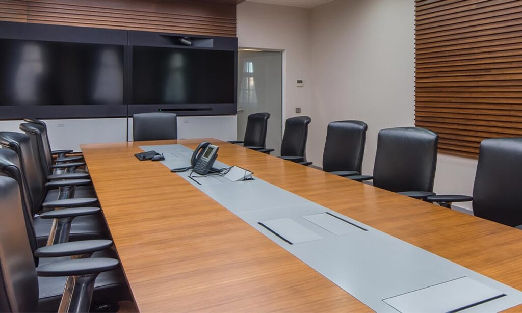 meeting room with chairs and tv screens