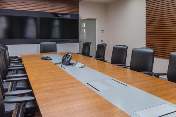 meeting room with chairs and tv screens