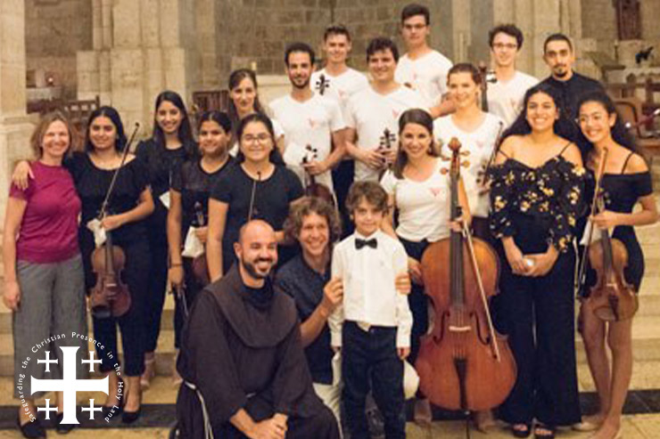 Magnificate Music Students Posing with Fr, Pari