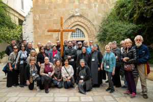 Pilgrims pose for group photo along the Via Dolorosa to the Church of the Holy Sepulchre